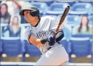  ?? Mike Carlson / Associated Press ?? The New York Yankees’ Gio Urshela follows through on his two-run single against the Toronto Blue Jays during the fourth inning on Wednesday.