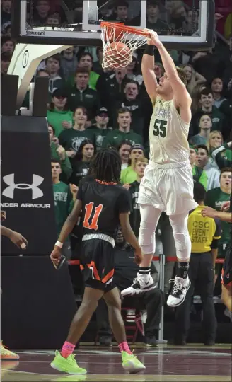  ?? PETE BANNAN — MEDIANEWS GROUP ?? Methacton’s (55) Jeff Woodward dunks it in the fourth quarter against Chester during their District 1-6A semifinal Tuesday.