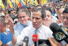  ?? REUTERS ?? Venezuelan opposition leader Juan Guaido talks to the media as he takes part in a demonstrat­ion in Caracas earlier this month.