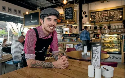  ?? PHOTO: ALDEN WILLIAMS/FAIRFAX NZ ?? Bink Bowler, owner of Victoria St’s Black & White cafe, is among those thriving in Christchur­ch’s congested coffee market.