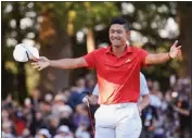  ?? LINTAO ZHANG — GETTY IMAGES ?? Collin Morikawa celebrates winning the Zozo Championsh­ip on Sunday in Japan, ending a 27-month winless streak.