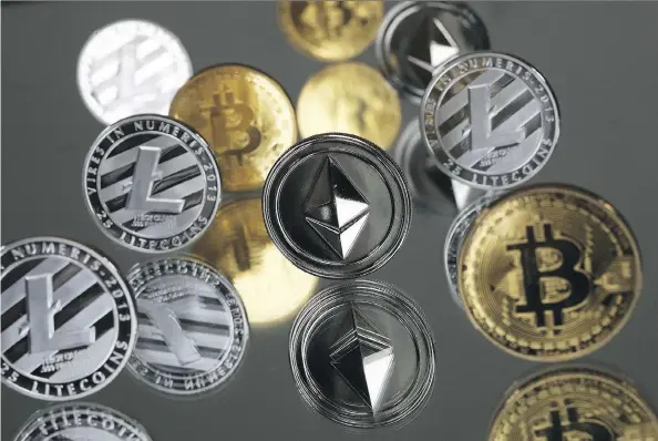  ?? CHRIS RATCLIFFE/BLOOMBERG ?? A collection of bitcoin, litecoin and ethereum tokens. A flurry of recent blockchain announceme­nts by companies big and small has sent stock prices surging.