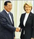  ?? TANG CHHIN SOTHY/AFP ?? Prime Minister Hun Sen (left) greets Australian Foreign Minister Julie Bishop in Phnom Penh in 2014.