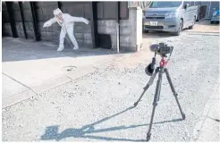  ??  ?? Kimiko Nishimoto takes a selfie outside her house in the western Japanese city of Kumamoto.