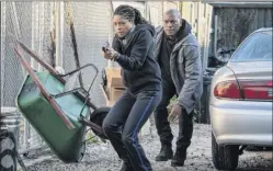  ?? Alan Markfield / Sony Pictures via AP ?? Naomie Harris, left, and Tyrese Gibson in a scene from “Black and Blue.”