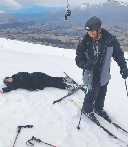  ??  ?? Travers ‘Candyman’ Beynon skiing at Coronet Peak with daughter Lucciana who took a tumbled in the snow and (below) with younger daughters Velicia and Serafina on the Kawarau Jet in Queenstown.