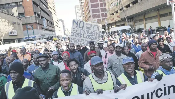  ?? Picture: Jacques Nelles ?? JOBLESS. Security workers march from Church Square to Tshwane House in protest against outsourcin­g yesterday.