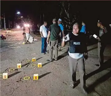  ?? PIC COURTESY OF THAILAND POLICE ?? Thailand police at the scene of the shooting in Sungai Golok town in southern Thailand on Tuesday night.