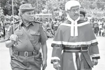  ??  ?? Palakai (left) escorting East New Britain’s new residentia­l Judge Justice Stephen Kassman during a guard of honour parade.