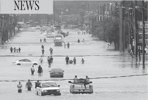  ?? THOMAS B. SHEA / AFP / GETTY IMAGES ?? Telephone Rd. in Houston on Sunday. While the governor of Texas thought there should be evacuation­s ahead of Hurricane Harvey, the mayor of Houston and officials in Harris County disagreed, urging residents to hunker down and ride out the storm.