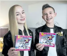  ?? JULIE JOCSAK/ STANDARD STAFF ?? Maci Wood and Ryan Sherk are members of the Mini Pops, a singing group comprising nine kids between the ages of nine and 15. Maci and Ryan are the only two from Niagara to make the group.