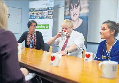  ?? Picture: PA. ?? The Institute for Fiscal Studies says the government of Boris Johnson, shown on a visit to Watford General Hospital yesterday, should consider implementi­ng carefully targeted and temporary tax cuts to support the economy after Brexit.