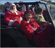  ?? COURTESY OF GEORGE AUPPERLEE ?? George Aupperlee of Harrisburg as Santa Claus rides in a Jeep with wife Kathy as Mrs. Claus during the 2019 Eastern Pennsylvan­ia Toy Run. The Aupperlees portrayed the jolly couple for the toy run and its predecesso­r event for 27 years. Kathy died Oct. 15, two weeks before this year’s run.