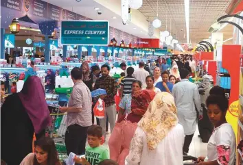  ?? Abdul Rahman/Gulf News Archives ?? Eid shoppers at a Lulu hypermarke­t in Abu Dhabi. Firms will not be able to recover VAT on costs related to Eid gifts and gifts for other festivals and special occasions for their employees.