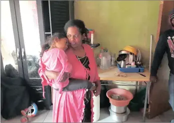  ?? PICTURES: DUNCAN GUY ?? LITTLE LEFT: Michelle Carpede, with her child Mirelle. They lost the little they had in last month’s flood.