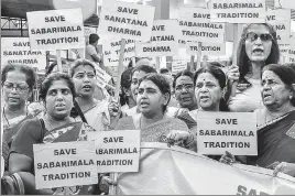  ?? PTI ?? ■ Lord Ayyappa devotees display placards during a protest rally against the Supreme Court order that allowed entry of women of all ages into the Sabarimala temple, in Nagpur, Wednesday.