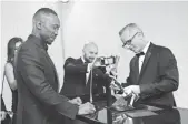  ?? POWERS IMAGERY, INVISION/AP ?? Moonlight’s Mahershala Ali, Oscar winner for best supporting actor, gets his name engraved on his golden statuette.