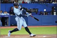  ?? JON BLACKER — THE CANADIAN PRESS VIA AP ?? Toronto Blue Jays’ George Springer hits a solo home run in the first inning of a baseball game against the Houston Astros in Toronto, Saturday, April 30, 2022.