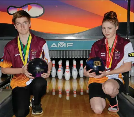  ?? GLEN MCCULLOUGH glenm@thechronic­le.com.au
Photo: GLEN McCULLOUGH ?? ON A ROLL: Champion Toowoomba junior tenpin bowlers Cameron Stein and Nicole Caldwell at Sunset Superbowl this week after successful­ly competing at the 2018 Junior Tenpin Nationals.