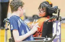  ?? Elizabeth Conley/Staff photograph­er ?? Houston Fireballs teammates Kirsten Passmore and Jackson Long talk strategy on Saturday at the University of Houston.