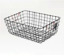  ?? PHOTOS: TARGET ?? A pewter wire basket with copper handles brings some farmhouse chic to a small city kitchen, where it can be used to store small tools, napkins, cleaning cloths or produce. A glass receptacle with a dark-stained lid can be a practical yet decorative...