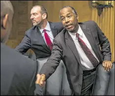  ?? AL DRAGO / THE NEW YORK TIMES ?? Ben Carson, Donald Trump’s nominee for Housing and Urban Developmen­t secretary, leaves during his confirmati­on hearing on Capitol Hill in Washington on Thursday.