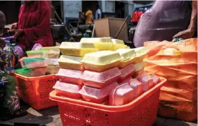  ?? ?? Packs of styrofoam containers filled with food and ready to be sent to the customers at Obalende in Lagos.