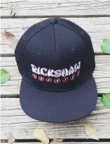  ??  ?? The Rickshaw merch store has everything from snapback hats to hoodies, face masks, and bandanas; a Stephen Hamm coffee cup comes in handy when reaching for the absinthe.