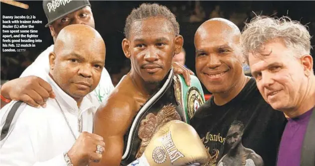  ?? GETTY ?? Danny Jacobs (c.) is back with trainer Andre Rozier (l.) after the two spent some time apart, and the fighter feels good heading into his Feb. 12 match in London.