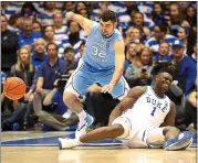  ?? STREETER LECKA — GETTY IMAGES ?? Duke’s Zion Williamson grimaces after injuring his knee after slipping and falling when his shoe fell apart.