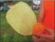  ??  ?? When a polymer ball and wooden racket collide, a sweet sound is made during a game of pickleball.