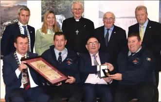  ?? Photos by Michelle Cooper Galvin ?? ABOVE LEFT: Justice Hugh O’Flaherty (seated centre fromleft) presenting the O’Flaherty Internatio­nal Humanitari­an Award to Divisional Controller Irish Marine Rescue Station Valentia John Draper, Officer in Charge Dingle Frank Heidtke, Officer in Charge Ballybunio­n T J McCarron, Deputy Officer in charge Iveragh Jonathan Walsh, with Jerry O’Grady, O’Flaherty Committee; Paul O’Neill, Killarney Chamber of Commerce; Catherine O’Flaherty; and Sen Paul Coghlan.LEFT: Mayor John Sheahan and Justice Hugh O’Flaherty presenting the O’Flaherty Award to Richard Quinlan and Leo Houlihan of RNLI Valentia with (back from left)Paul O’Neill, Killarney Chamber of Commerce; Catherine O’Flaherty; Bishop Ray Browne; Sen Paul Coghlan; and Jerry O’Grady, O’Flaherty Committee, at Killarney House on Saturday.