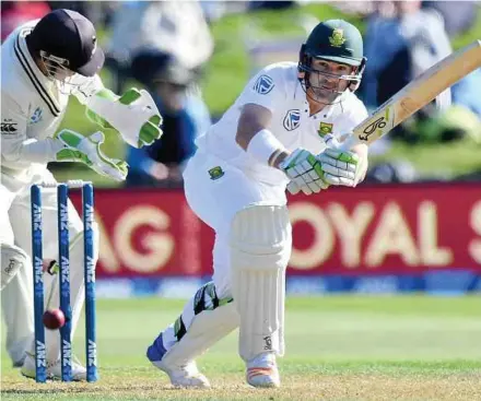  ?? AFP PIC ?? South Africa’s Dean Elgar (right) bats while New Zealand’s BJ Watling reacts on the first day of their first Test at the University Oval in Dunedin yesterday.