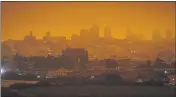  ?? ERIC RISBERG — THE ASSOCIATED PRESS FILE ?? On Sept. 9at 11:18a.m., a dark orange sky above Crissy Field in San Francisco is seen. It was caused by heavy smoke from wildfires.