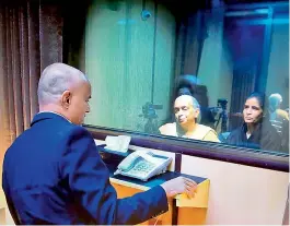  ??  ?? Former Indian Navy officer Kulbhushan Jadhav’s wife and mother meet him while seated across a glass partition at the Pakistan Foreign Office in Islamabad on Monday. — PTI