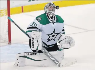  ?? BRYNN ANDERSON
THE ASSOCIATED PRESS ?? Dallas Stars goaltender Anton Khudobin keeps his eye on the puck during a game against the Florida Panthers on Tuesday.