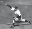  ??  ?? New York Yankees pitcher Don Larsen delivers a pitch against the Brooklyn Dodgers, enroute to a perfect game in Game 5 of the World Series, 61 years ago Sunday.