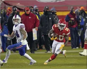  ?? JEFF ROBERSON - THE ASSOCIATED PRESS ?? Kansas City Chiefs wide receiver Tyreek Hill (10) runs up field after catching a pass during the second half of the AFC championsh­ip NFL football game against the Buffalo Bills, Sunday, Jan. 24, 2021, in Kansas City, Mo.