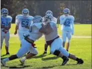  ?? BY NICK TOPPING- NTOPPING@DIGITALFIR­STMEDIA.COM ?? Kevin Toote and Brandon Camaj tackle each other during drills during Saratoga practice Tuesday. Toote is one of the leaders on both lines for Saratoga team and hopes to lead them to a win over Troy in the finals matchup.