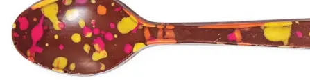  ??  ?? Chocolate gets an art-class remix with edible spoons that recall Pollock paintings.