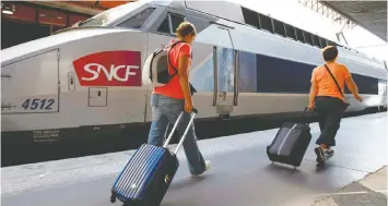  ?? ASSOCIATED PRESS FILES ?? Passengers board a high-speed TGV inter-city train in France. A similar high-speed link is envisioned between Vancouver and Portland.