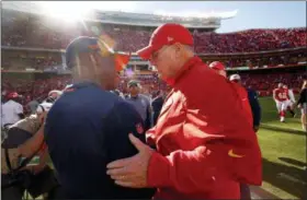  ?? CHARLIE RIEDEL - THE ASSOCIATED PRESS ?? Kansas City Chiefs head coach Andy Reid, right, and Denver Broncos head coach Vance Joseph greet each other after their NFL football game Sunday, Oct. 28, 2018, in Kansas City, Mo.