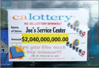  ?? DEAN MUSGROVE — STAFF PHOTOGRAPH­ER ?? A lottery winner sign at Joe's Service Center in Altadena on Feb. 14, lets customers know that the station sold a $2billion winning ticket. That winner will be revealed Tuesday in Sacramento.