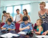  ?? PROVIDED TO CHINA DAILY ?? Officers from the Chongqing Public Security Bureau’s Exit-Entry Administra­tion Division serve foreigners at their workplace.