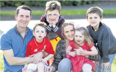  ??  ?? ●● Lucy and Mike Carroll with Ollie and Amelia and their two other children, Danny and Micky