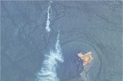  ?? AFP ?? A satellite image released by Maxar Technologi­es shows a possible missile attack on a landing craft near Ukraineown­ed Snake Island in the Black Sea near the Danube Delta, on Thursday.