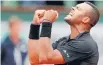  ?? Photo: REUTERS ?? Jo-Wilfried Tsonga celebrates after beating Tomas Berdych to make the French Open quarterfin­als.