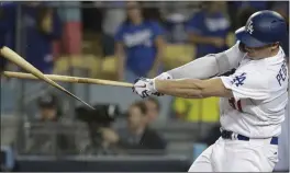  ?? JAE HONG — ASSOCIATED PRESS ?? Palo Alto’s Joc Pederson breaks his bat during the 12th inning of Game 4 of the National League Championsh­ip Series baseball game against the Milwaukee Brewers on Tuesday.