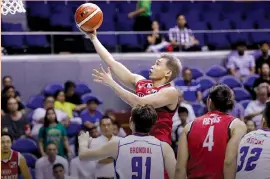  ?? PBA PHOTO ?? Jackson Corpuz of the Kia Picanto goes up for a shot during their game against the Magnolia Hotshots last night at the Smart Araneta Coliseum.