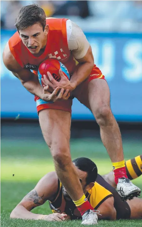  ?? Picture: GETTY IMAGES ?? Suns midfielder Jarryd Lyons marks against Hawthorn at the MCG.